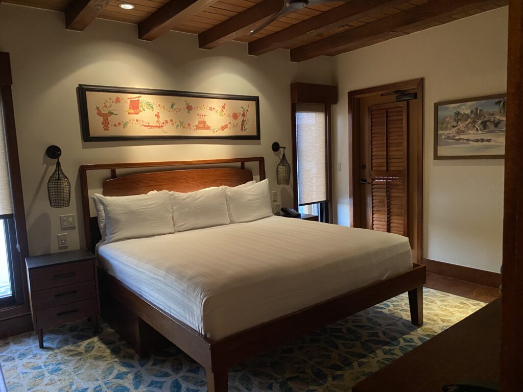 master bedroom with deck access and king size bed