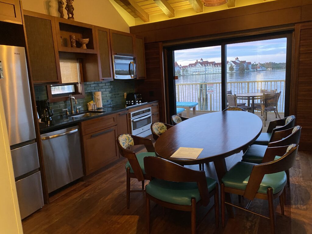 bora bora bungalow kitchen and dining area with full size amenities and dining table with 8 seats