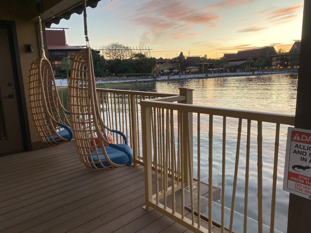 image of seating area on the deck at the side of the polynesian bungalow - facing the resort transportation boats